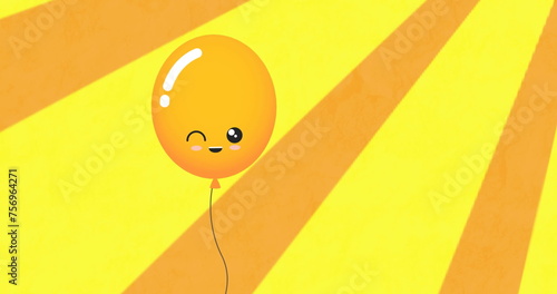 Image of yellow balloon with smile flying on yellow background