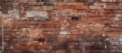 Weathered red and brown brick wall texture for background.