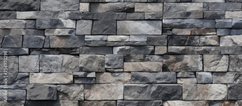 Granite wall with different-sized stone tiles.