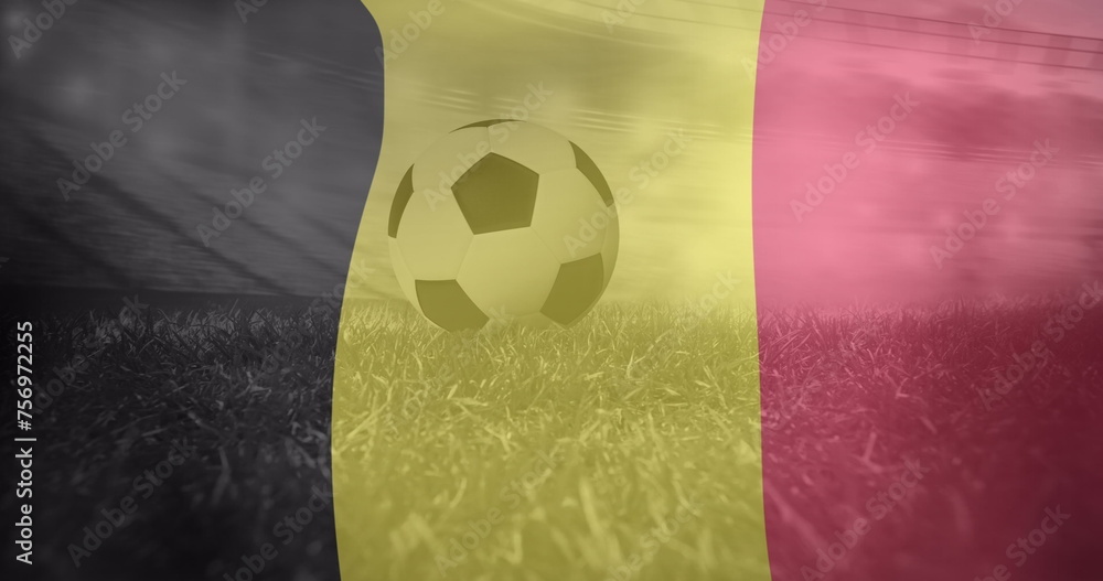 Naklejka premium Image of flag of belgium over football on stadium