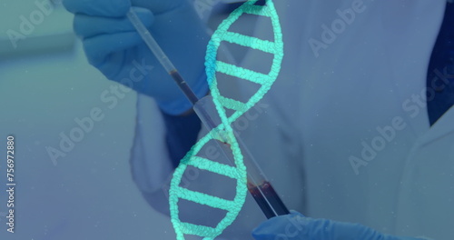 Image of rotating DNA strand and over scientist wearing lab coat working in a lab