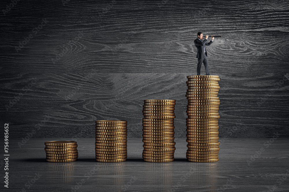 Φωτογραφία Side view of man with telescope standing on stacked golden coins financial chart on dark wooden wall background