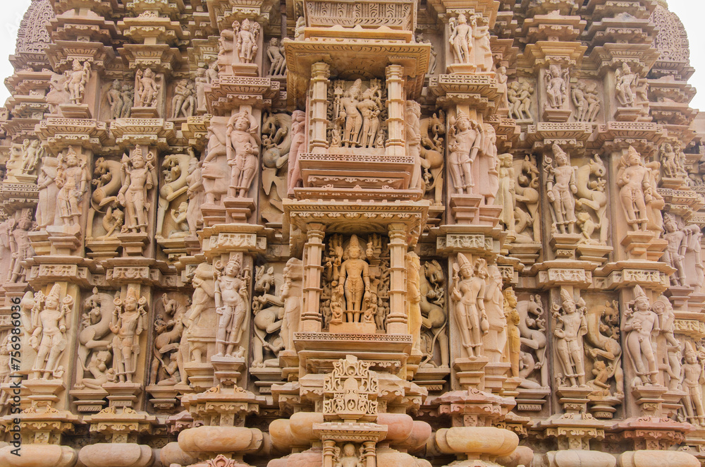 Stone carved sculptures on the outer wall of the Devi Jagdamba temple, Western group of monuments, Khajuraho, Madhya Pradesh, India, Asia.