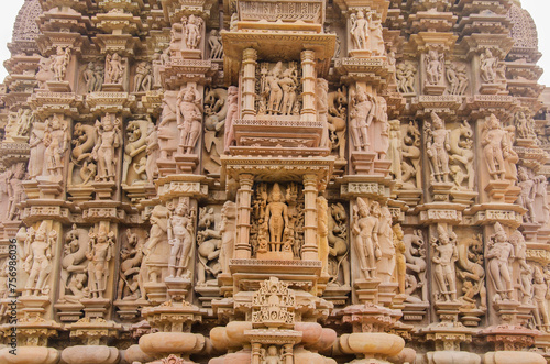 Stone carved sculptures on the outer wall of the Devi Jagdamba temple, Western group of monuments, Khajuraho, Madhya Pradesh, India, Asia.
