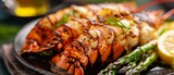 Closeup of grilled lobster tails with asparagus and bearnaise sauce