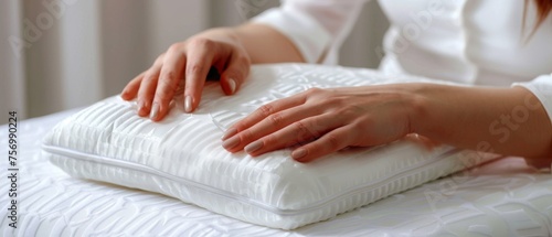Closeup of female hands on orthopedic pillow