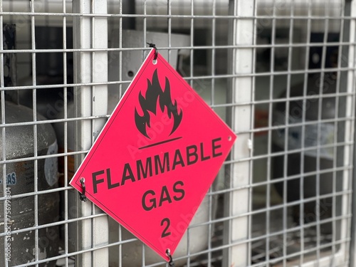 Flammabl gas sign on gas cylinders cage