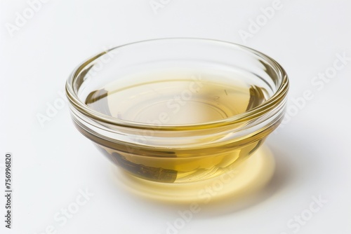 Macro photo of coconut oil in a bowl on white background extracted from mature coconuts