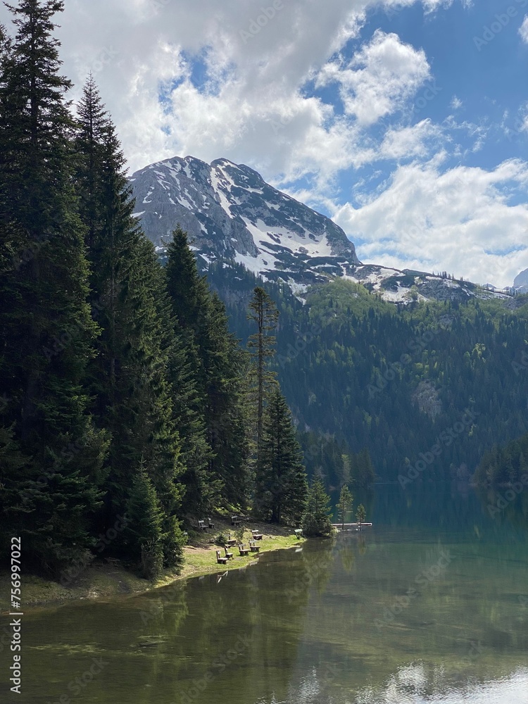 Serene Alpine Lake Reflecting Snowy Peak