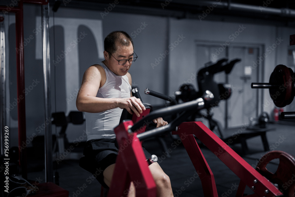 Men exercise their arm muscles in the gym Men exercise their arm muscles in the gym