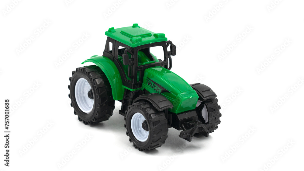 Naklejka premium Green toy tractor isolated on white background.