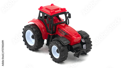 Red toy tractor isolated on white background.