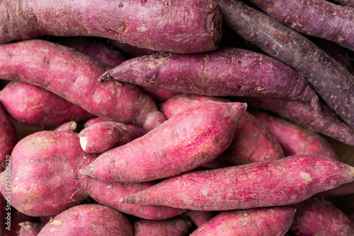 Organic raw sweet potatoes background, Top view