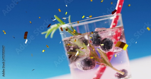 Image of confetti falling and cocktails on blue background