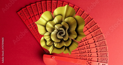 Image of chinese pattern and fan with copy space on red background