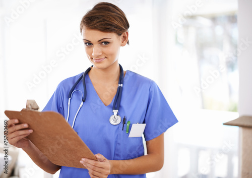 Happy woman, portrait and nurse with clipboard for prescription or medical checklist at hospital. Female person, practitioner or scrub with smile, documents or paperwork for life insurance at clinic