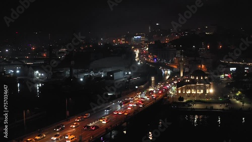 Flying above highway bridge in Istanbul between Beyoglu and Eminönü districts at night photo