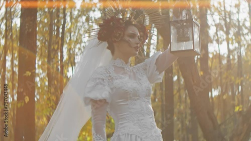 Enchanted forest wedding theme with model in elaborate bridal gown and unique headpiece. Artistic makeup and fantasy styling for an ethereal bridal look. Perfect for editorial, costume design, and