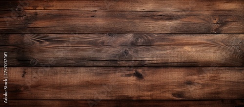 A close up of a hardwood brown wooden wall plank with a blurred background, showcasing the beautiful wood stain and natural pattern of the wood flooring