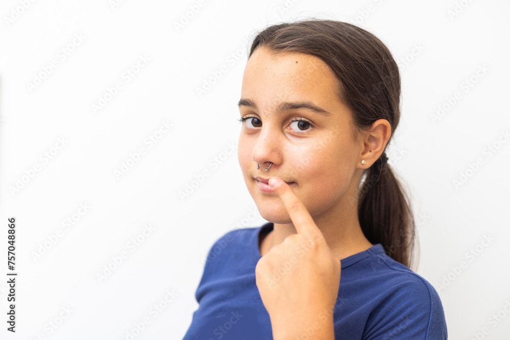Attractive modern girl with piercings on her face Attractive modern girl with piercings on her face