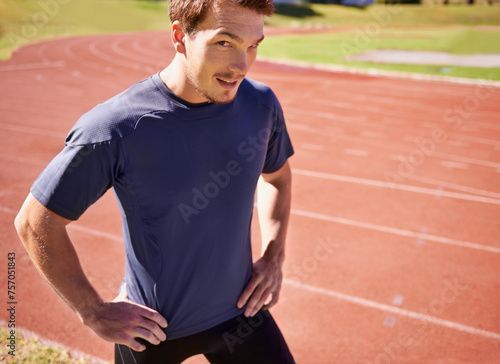 Portrait runner and track with man, training and fitness with sunshine and cardio for sports and practice for competition. Face, person and athlete with workout for wellness and health with exercise