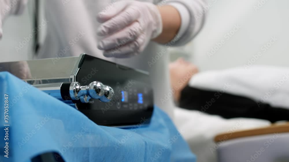 Beautiful woman receiving facial microcurrent treatment at spa salon. Beautician using electrical impulses for facial procedures. Woman in spa salon. Woman in a spa salon on cosmetic procedures. Beautiful woman receiving facial microcurrent treatment at spa salon. Beautician using electrical impulses for facial procedures. Woman in spa salon. Woman in a spa salon on cosmetic procedures.
