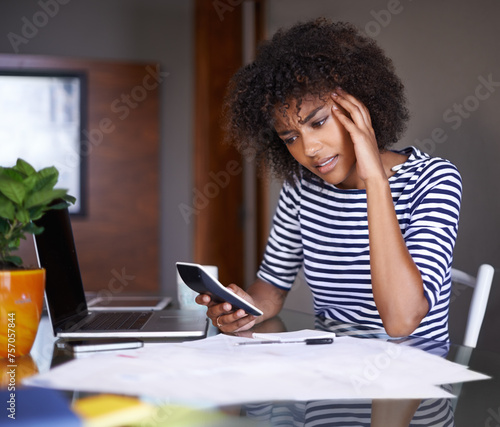 Woman, finance and thinking of stress at home, table with documents for tax and calculating debt. African female person, debit bill for online payment report, budget or planning for accounting audit