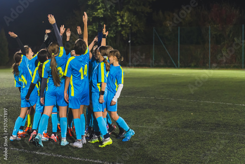 full shot of school girls football team getting ready with a coach for the match, soccer team concept. High quality photo