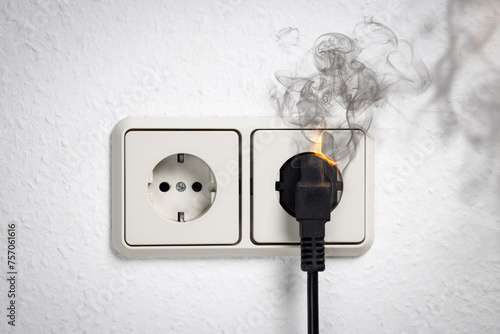 Electric Plug and Socket with Smoke and Fire photo