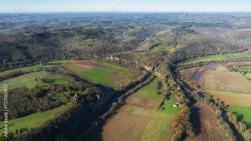 High-altitude drone photo of the Vézère Valley with the Château de Marzac, the troglodytic village of La Madeleine in Tursac and the Dordogne River. photo