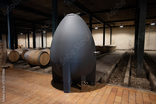 WIne celler with french concrete egg shape wine tank for aging of red wine, Haut-Medoc vineyards in Bordeaux, left bank Gironde Estuary, Pauillac, France