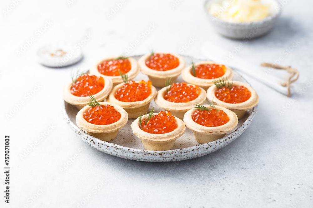 Red caviar served in tartlets Red caviar served in tartlets