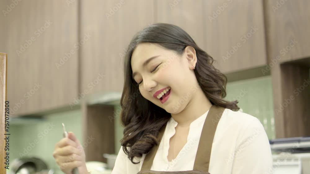Young women cooks pancakes in kitchen, Beat dough with whisk, Preparing Cookies, Cooking, Homemade
Young women cooks pancakes in kitchen, Beat dough with whisk, Preparing Cookies, Cooking, Homemade