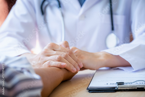 The doctor hands holding patient hand to encouragement and explained the health examination results  medical checkup concept