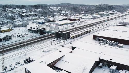 European Route E45 And Train Station With Snow-covered Surroundings In Winter. Alvangen In Vastra Gotaland, Sweden. aerial shot photo