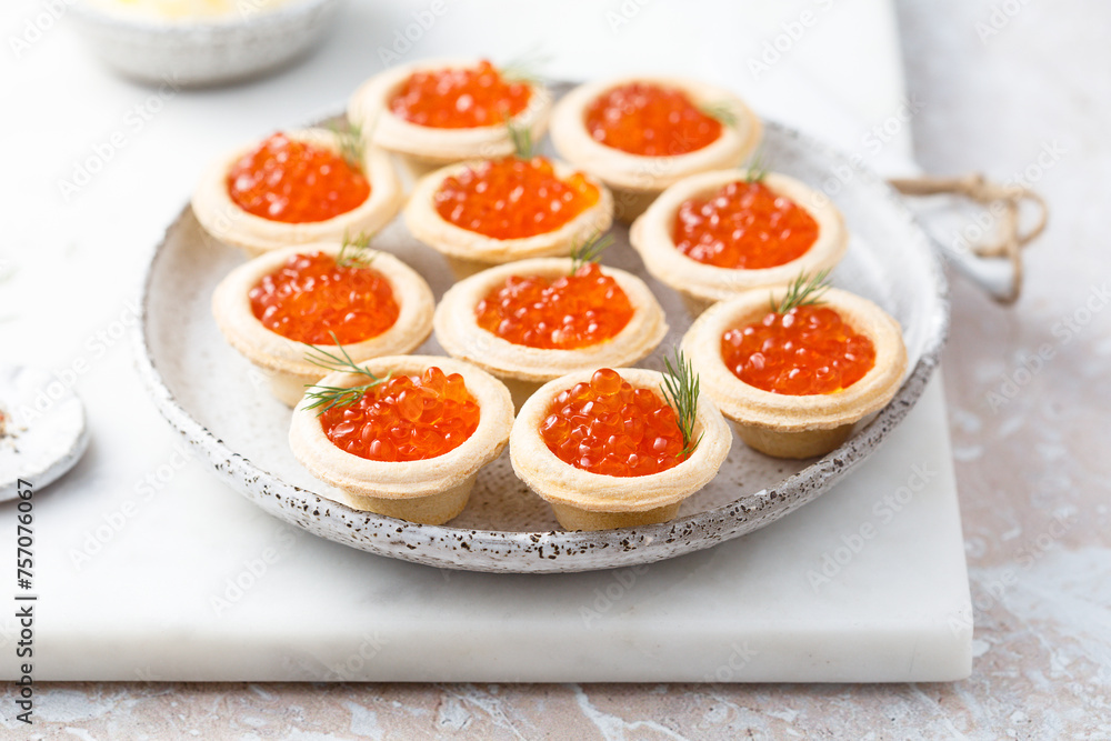 Red caviar served in tartlets Red caviar served in tartlets