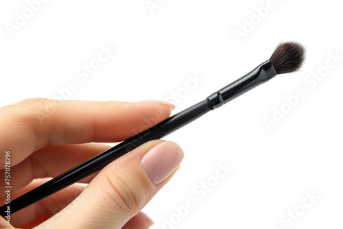 Hand holding make-up brush cosmetic isolated on gray