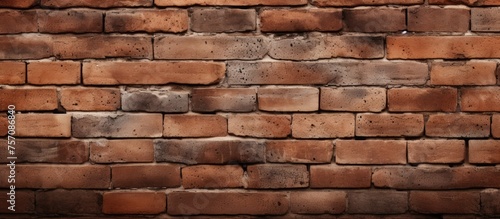 Detailed close up of a brown brick wall showcasing the intricate brickwork of the composite building material. Each brick adds character to the sturdy structure