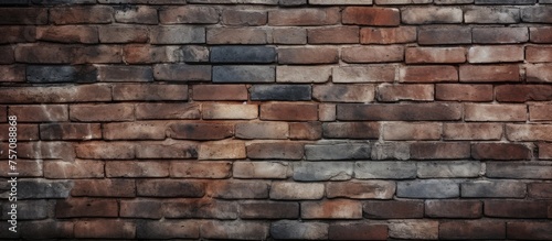 A detailed closeup of a brown brick wall showcasing the rectangular shapes of each brick. The brickwork is a composite building material commonly used for facades, building structures, and flooring