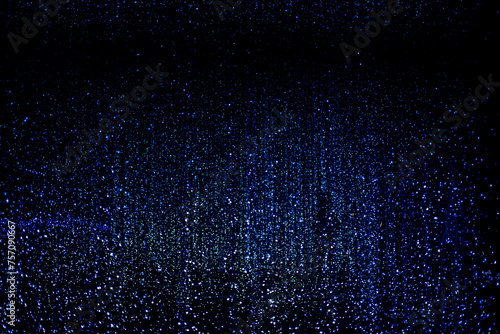Celebration lights at Christmas New Year festival. Crowd of hanging blue light bulbs blue bokeh background. blue light bulb tunnel. 