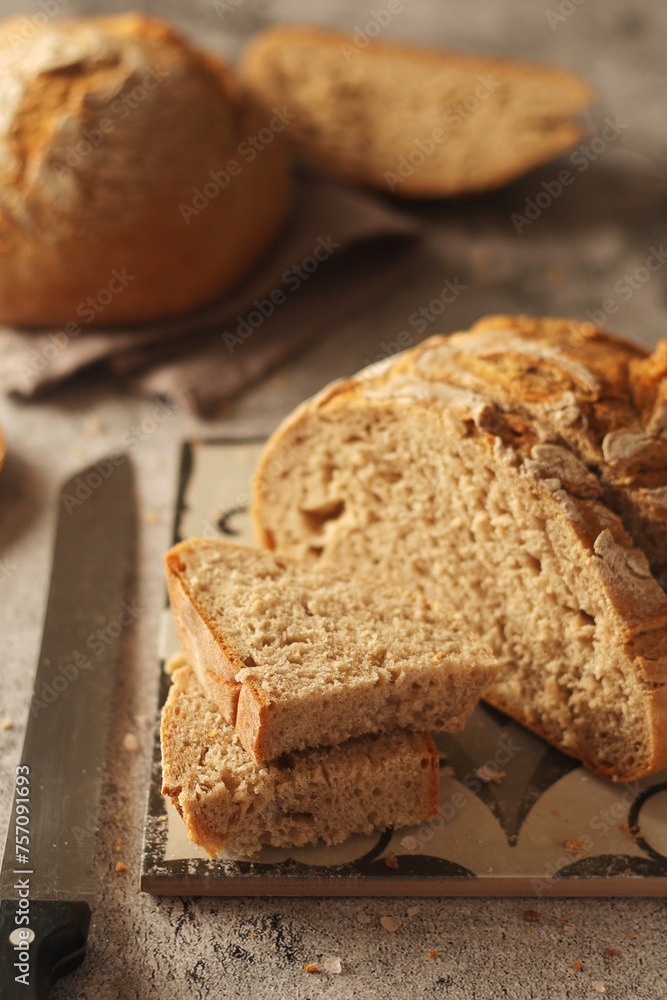 A loaf of rye bread in low key	