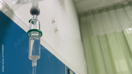 Closeup of IV drip in hospital, Intravenous saline solution, IV loading dose.