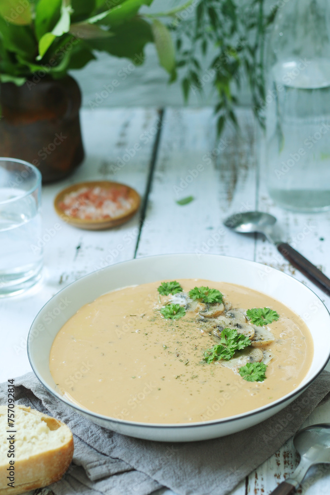 A bowl with mushroom cream soup A bowl with mushroom cream soup