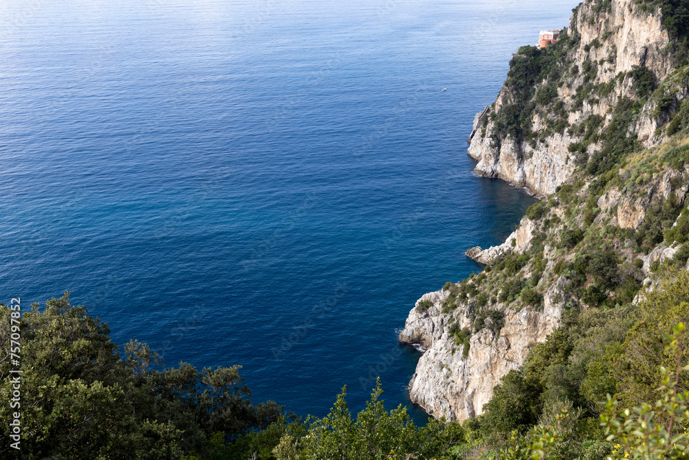 Amalfi coast, view of the mountainous coast washed by the sea and caressed by the blue sky