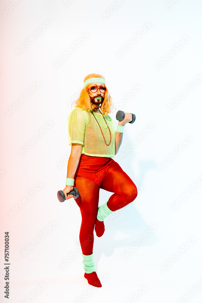 Vibrant Drag Queen in 80s Sportswear Exercising With Dumbbells Against White Background Vibrant Drag Queen in 80s Sportswear Exercising With Dumbbells Against White Background