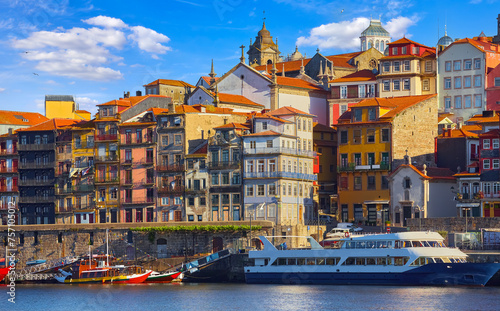 Porto, Portugal. Pleasure boats at Douro river. View porto city old town with authentic houses. Picturesque landscape. Popular travel destination in Europe.
