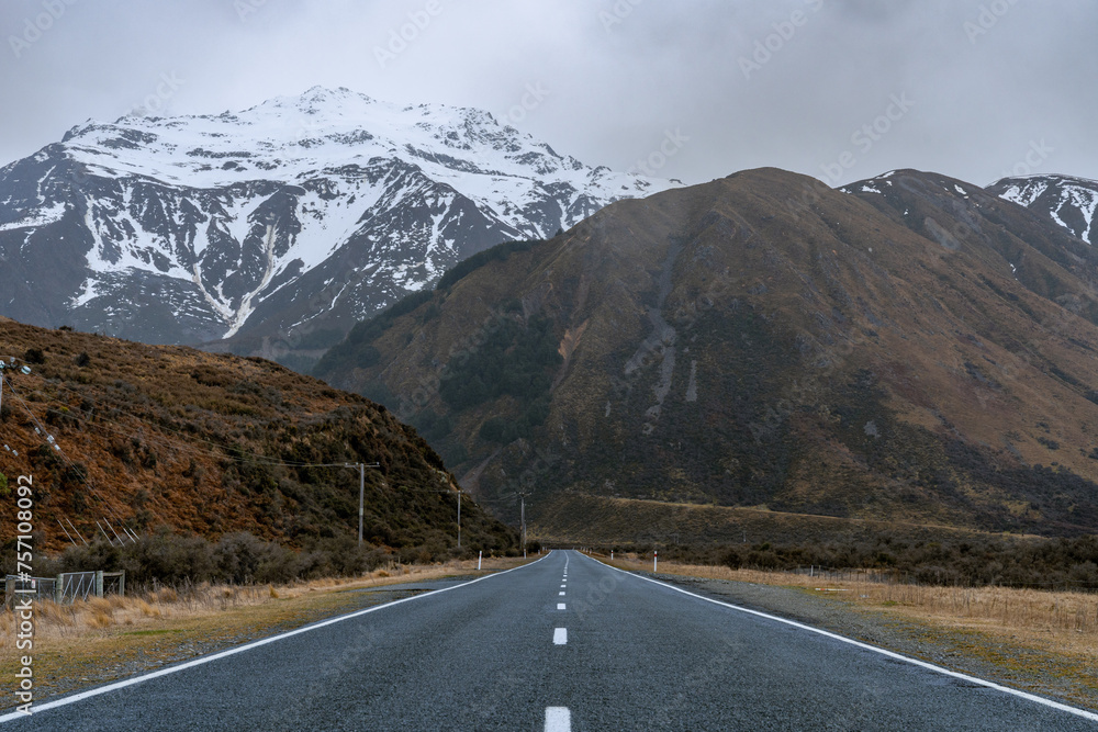 Scenic road to Mount Cook, New Zealand. Moody landscape with winding paths and tranquil vistas. Perfect for travel and adventure themes.