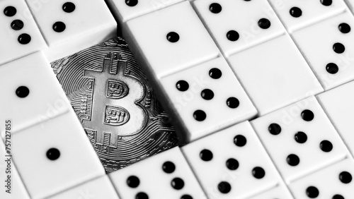 Bitcoin and dominoes. Stock trading, investment and business concept.