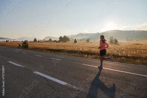 Determined Dawn: Confident and Motivated Athlete Embarks on Sunrise Run. © .shock