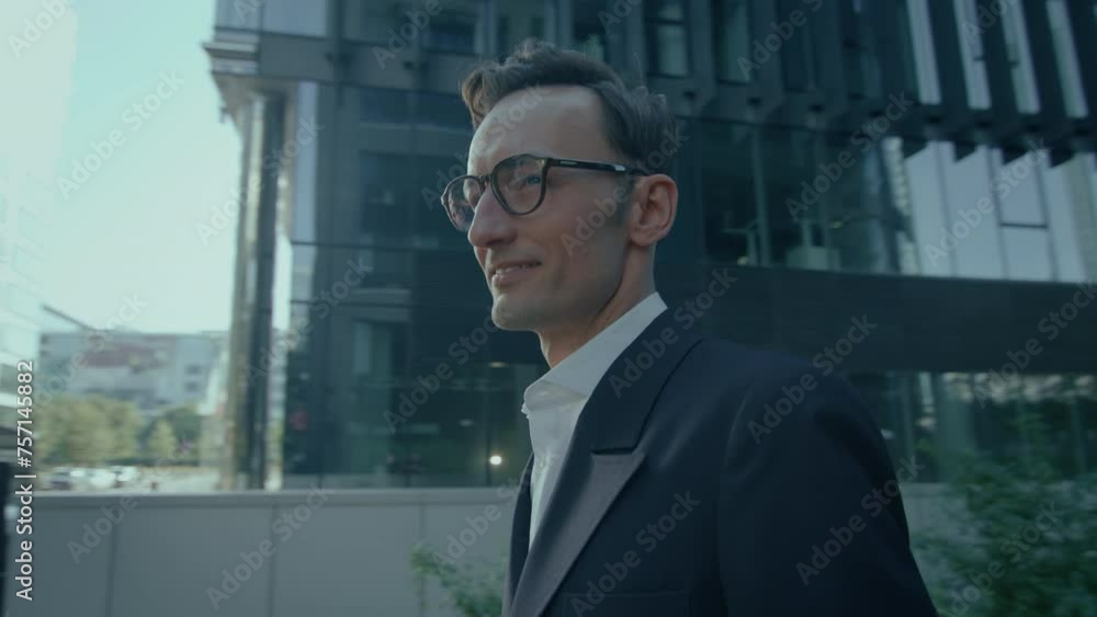 Elegant Handsome Caucasian Man In Suit And Glasses Outdoors Smiling Looking At Camera Elegant Handsome Caucasian Man In Suit And Glasses Outdoors Smiling Looking At Camera
